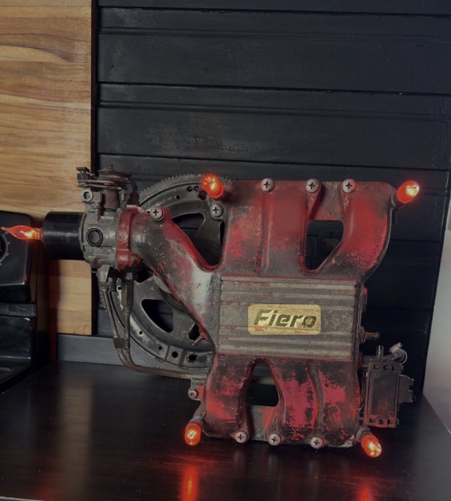 Fiero Engine Lamp made from a red intake manifold with amber lights